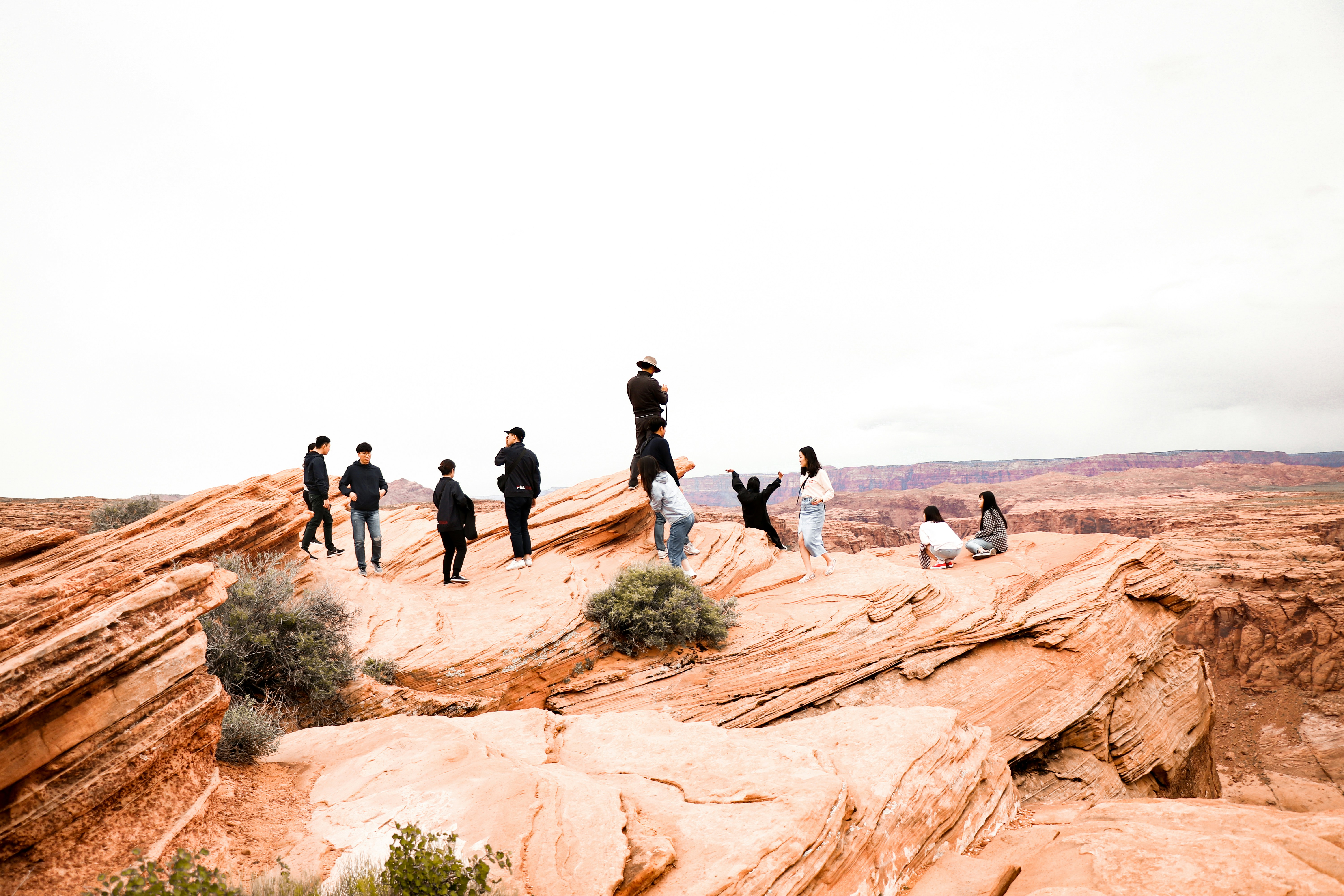 people walking on brown sand during daytime