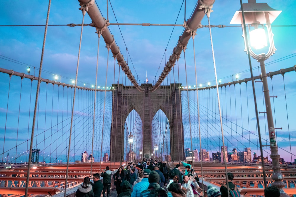 people walking on bridge during daytime