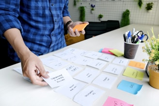 person holding white printer paper