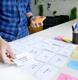 person holding white printer paper