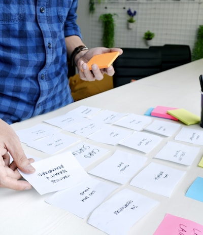 person holding white printer paper