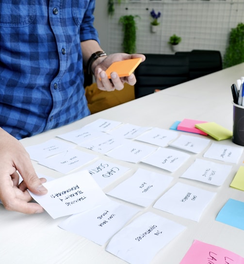 person holding white printer paper