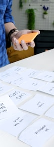 person holding white printer paper