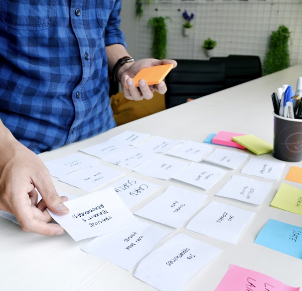 person holding white printer paper