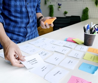 person holding white printer paper