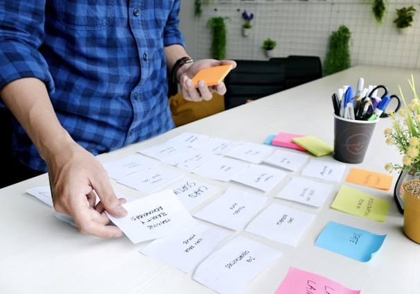 person holding white printer paper