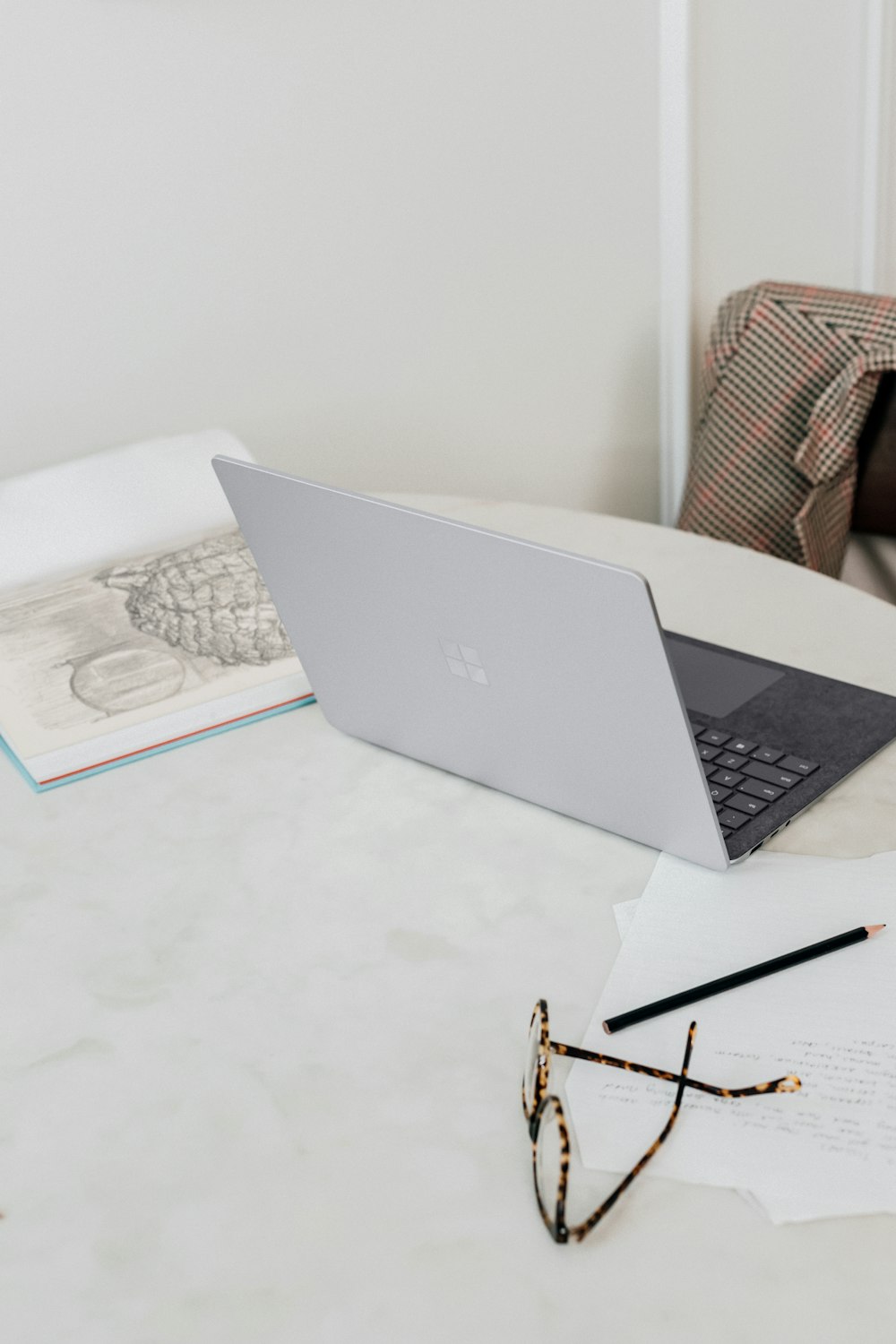 microsoft surface laptop  on white table