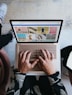 person using microsoft surface laptop on lap with two other people