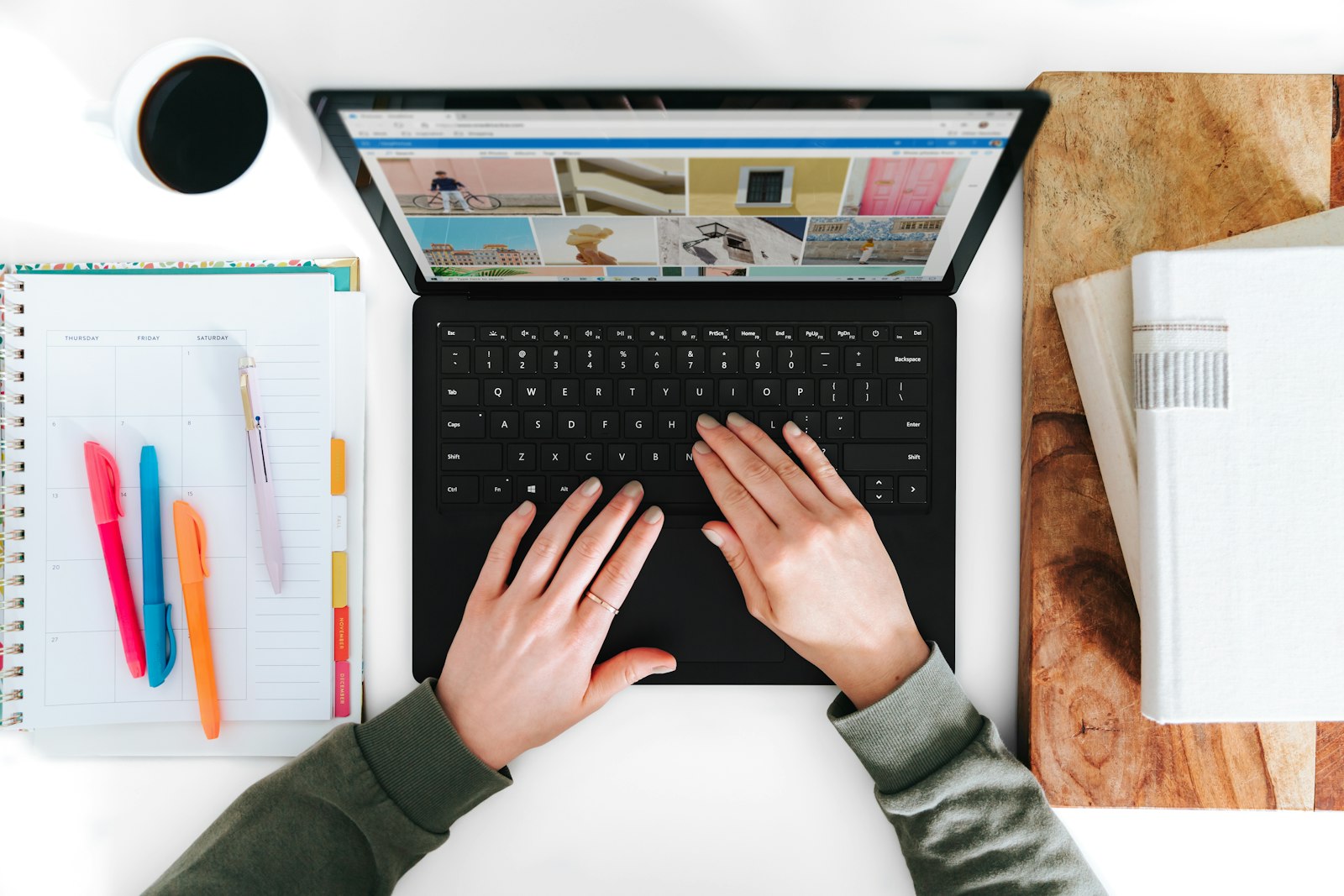 Person cross-checking a program's accreditation claims on a laptop