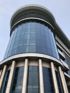 A modern commercial building with glass facade.