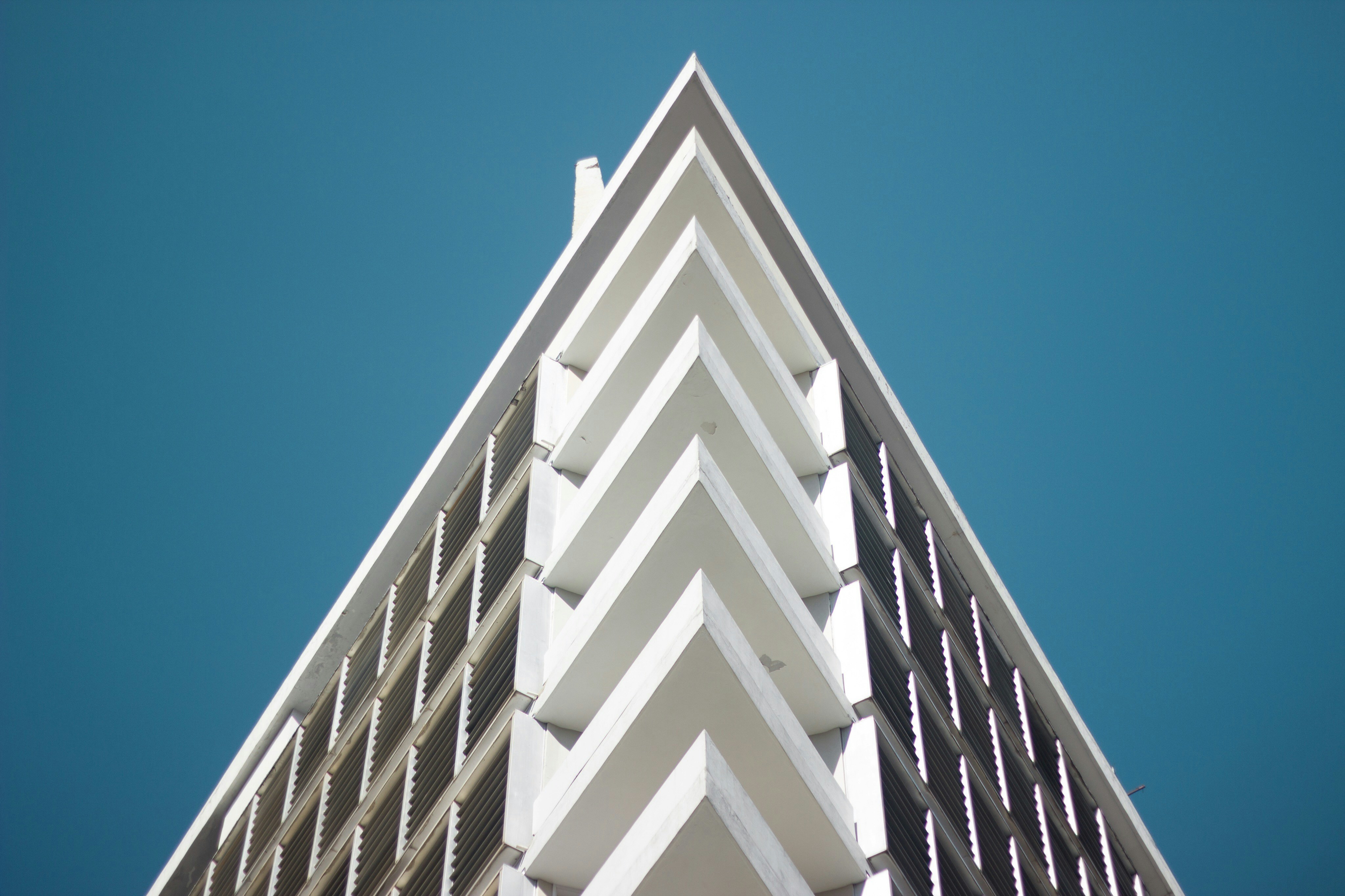 white concrete building under blue sky during daytime paraguay teams background