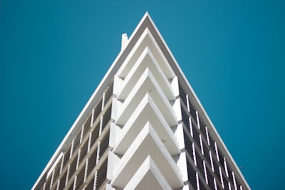 white concrete building under blue sky during daytime paraguay teams background