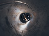 Close-up of a sewer camera navigating a narrow pipe.