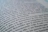 A close-up view of a page from a book with text in a language similar to Spanish. The focus is on specific lines that mention locations like Stanford and Palo Alto, while the rest of the text gradually blurs towards the edges.