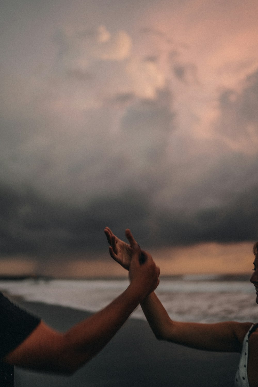 person lying on beach shore during daytime