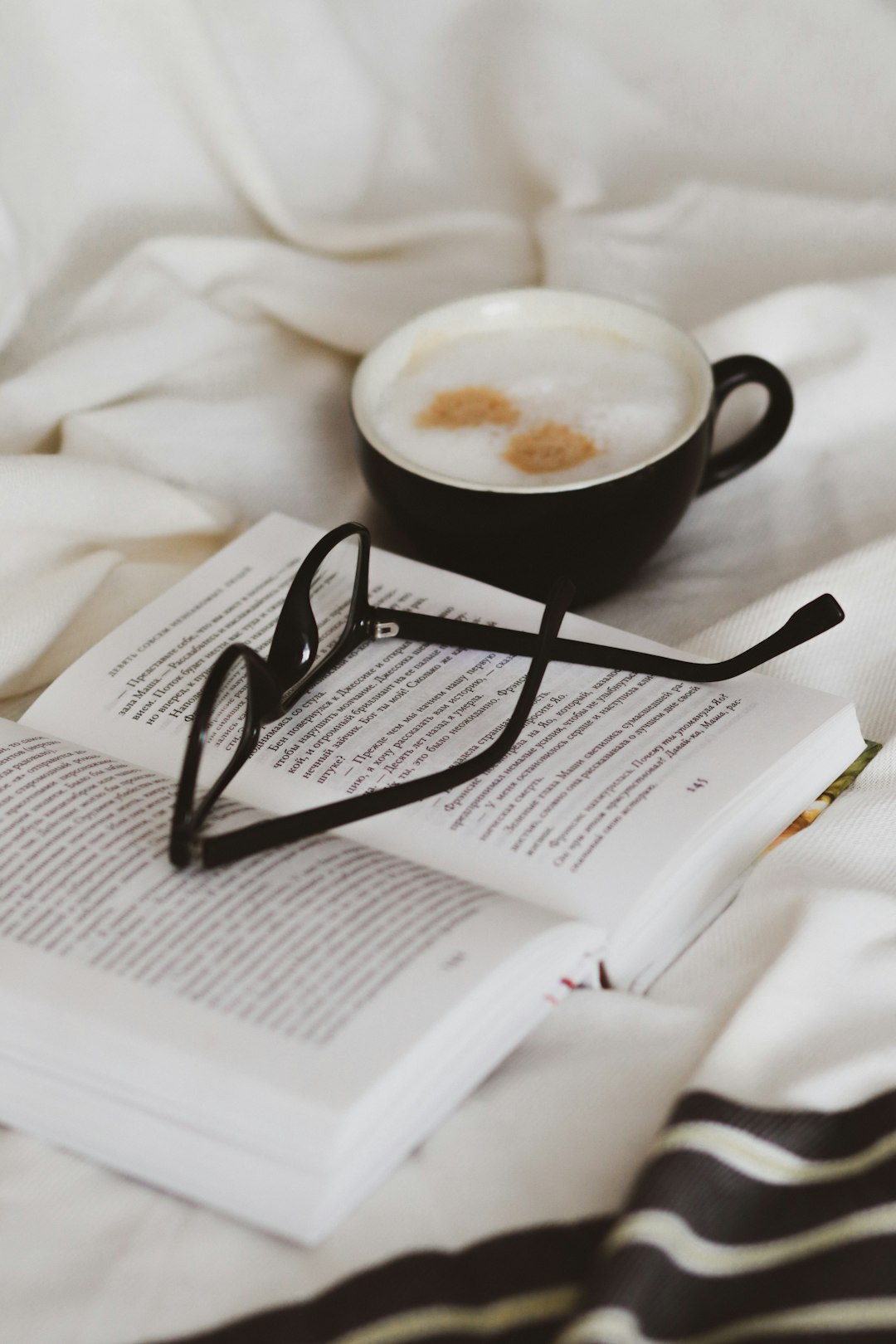 black ceramic mug on white book page