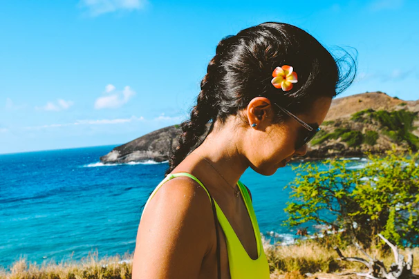Close-up of a vibrant Caribbean-style wig flowing in the seaside breeze.