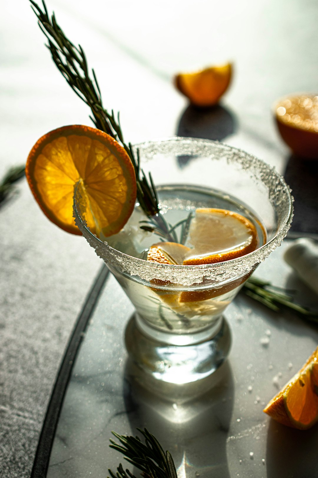 clear drinking glass with sliced orange fruit