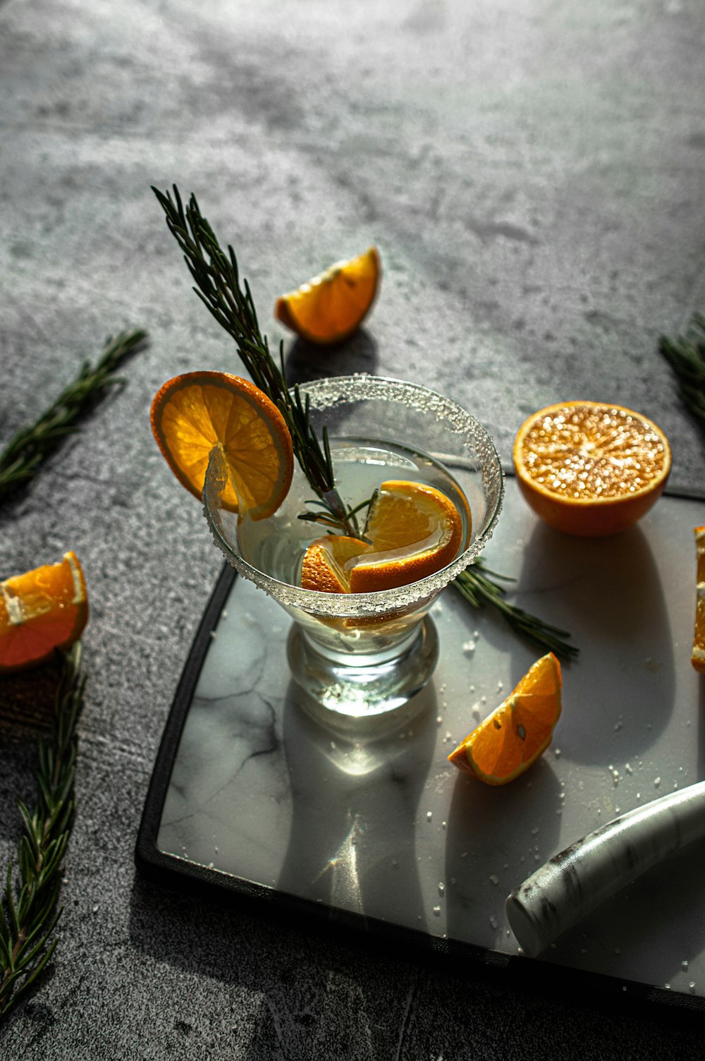 sliced orange fruit on clear glass cup