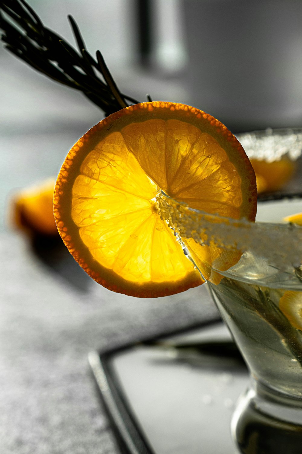 orange fruit on clear drinking glass
