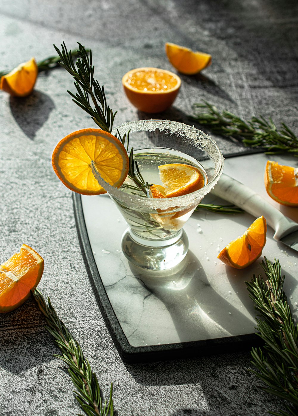 sliced orange fruit on clear glass bowl