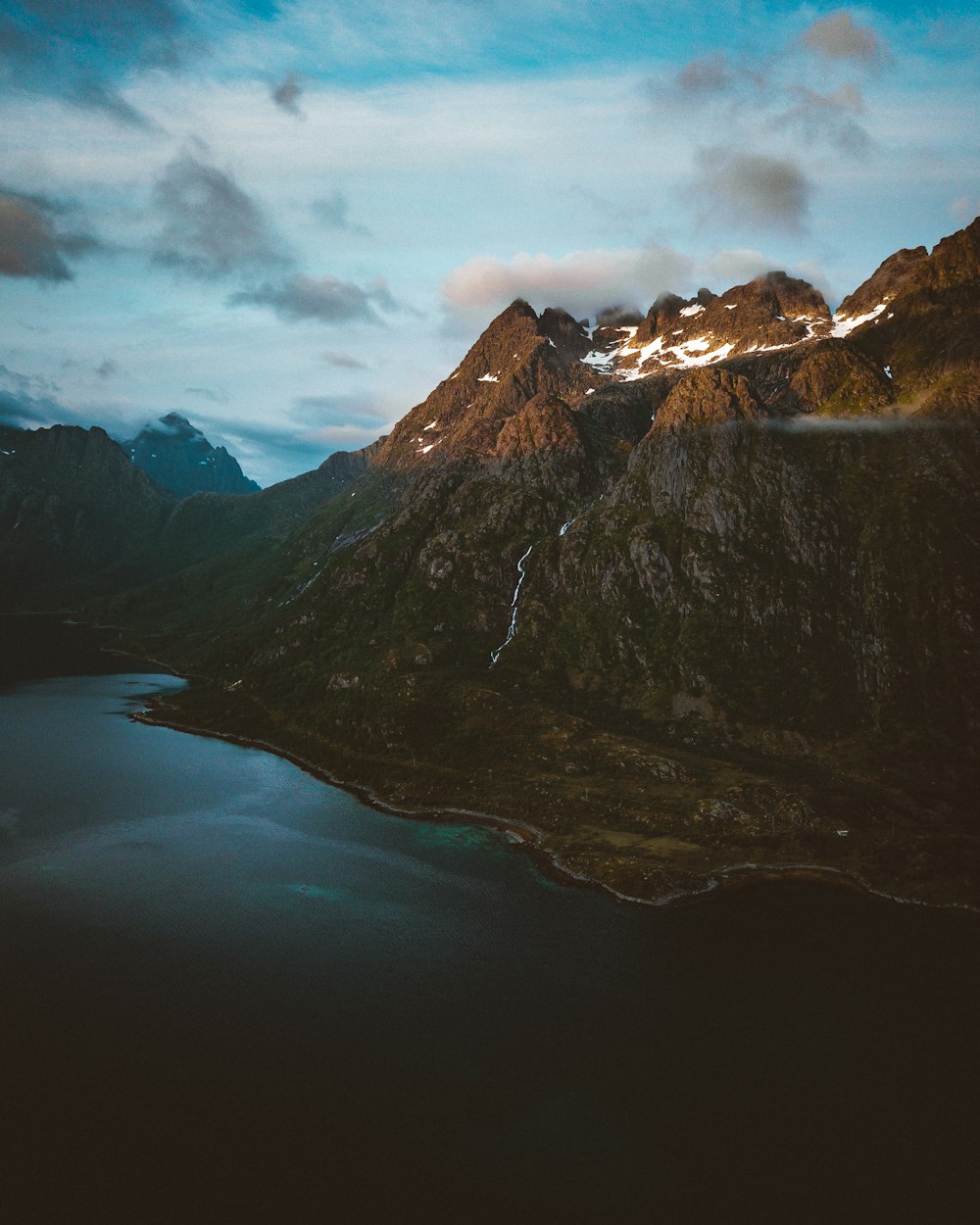 lake in the middle of mountains