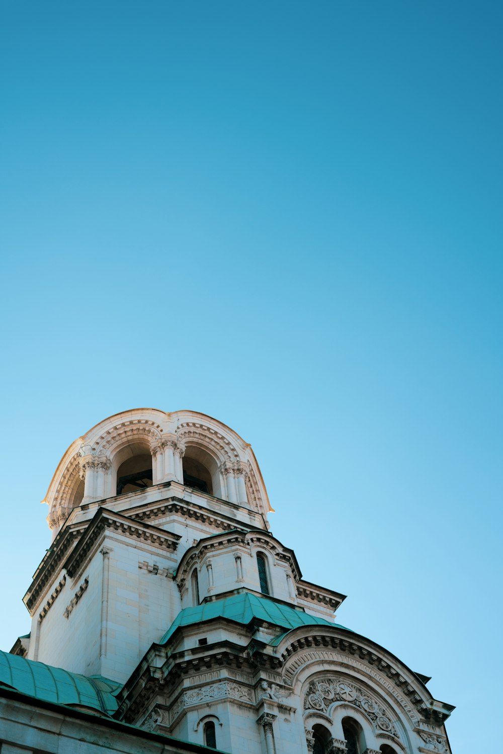 white concrete building under blue sky during daytime