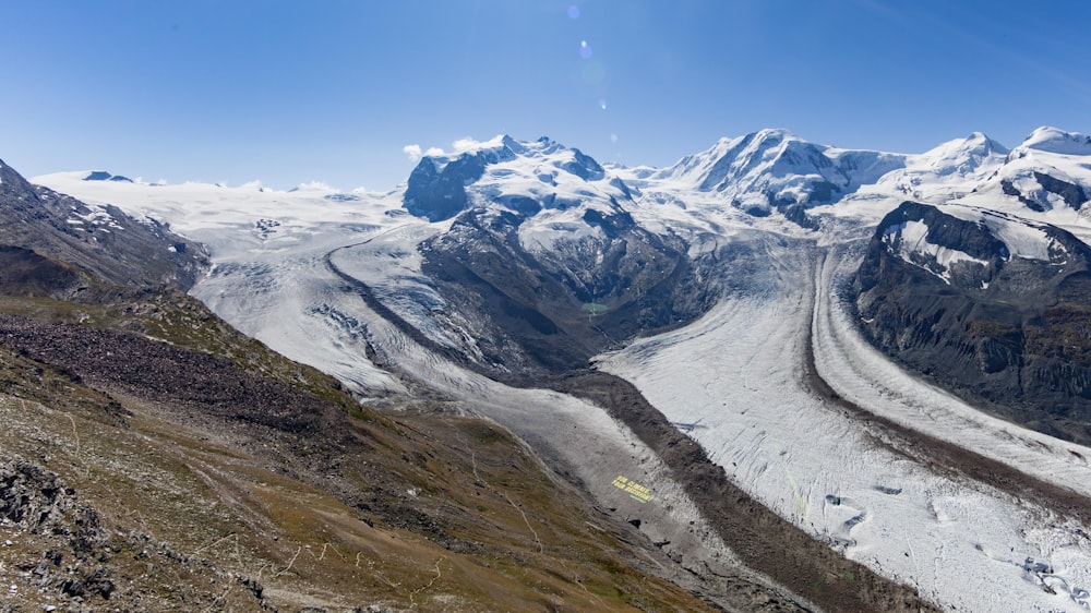 snow covered mountain under blue sky during daytime