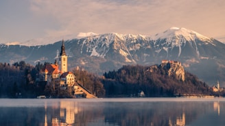 A serene view of Saint Thomas Mount Church bathed in early morning light with worshippers entering for Holy Qurbana.