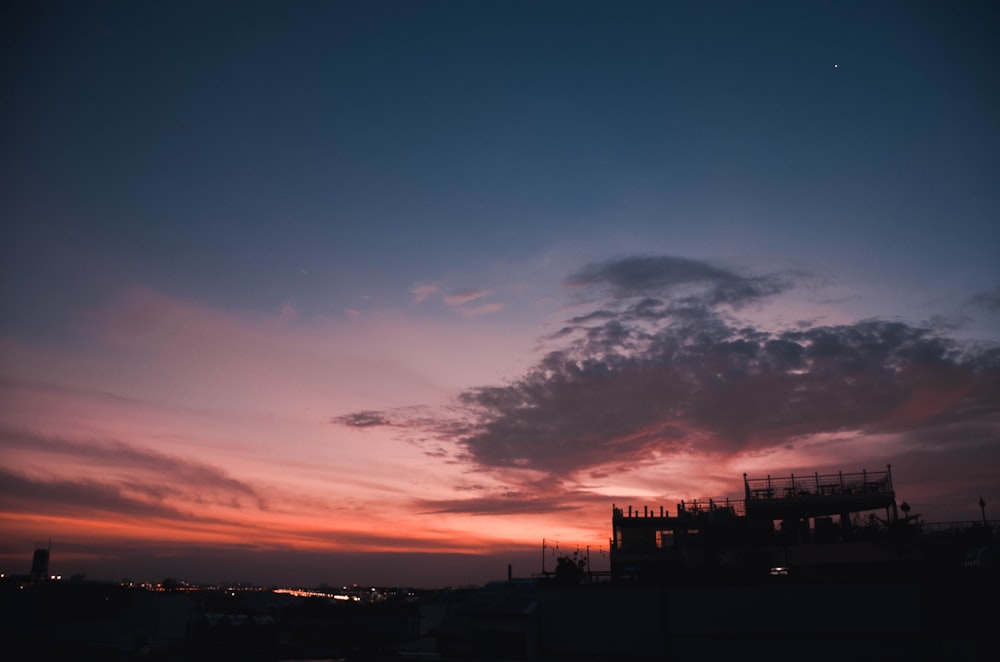 silhouette of buildings during sunset