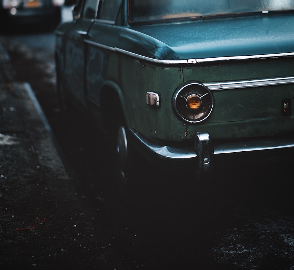 green car on road during daytime