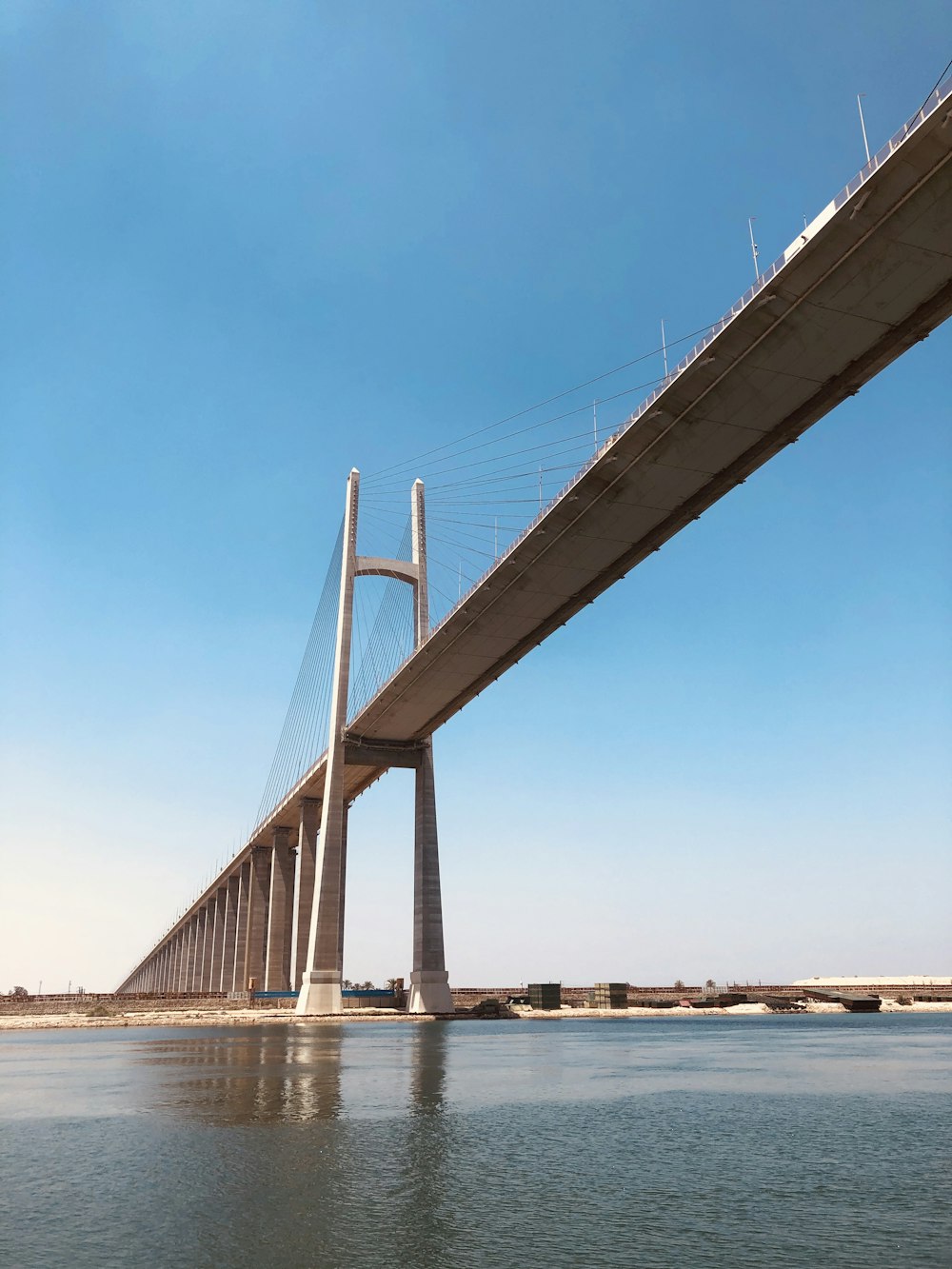 brown bridge over body of water during daytime