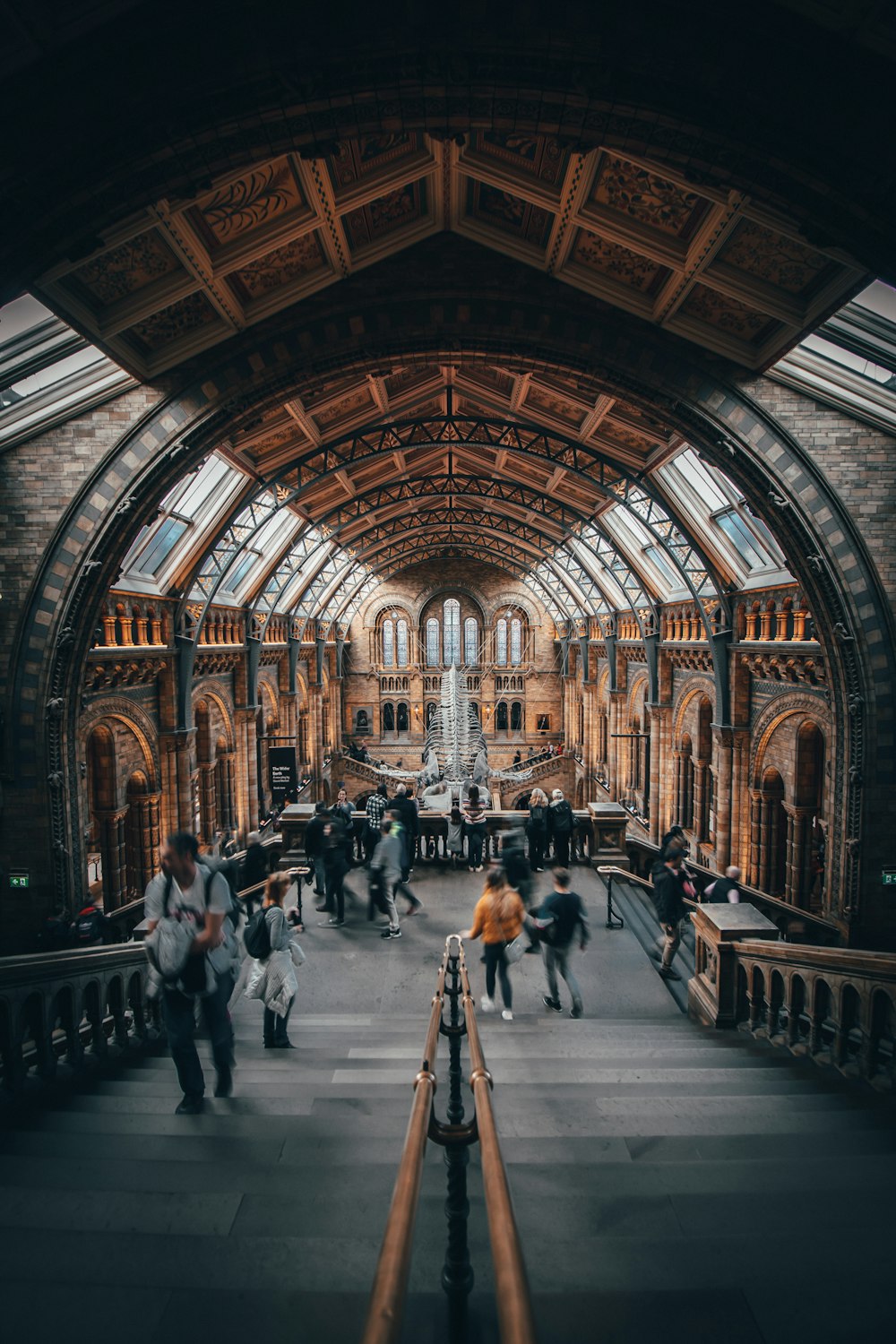 people walking inside brown and gray building