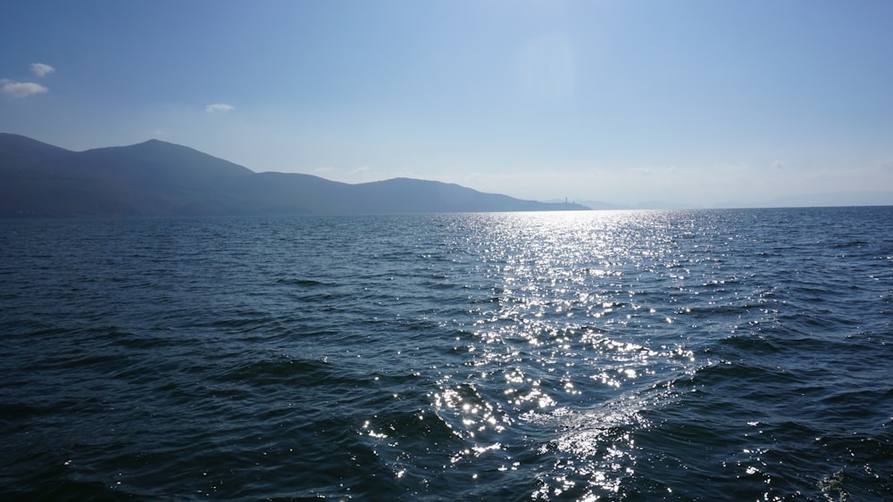 body of water under blue sky during daytime