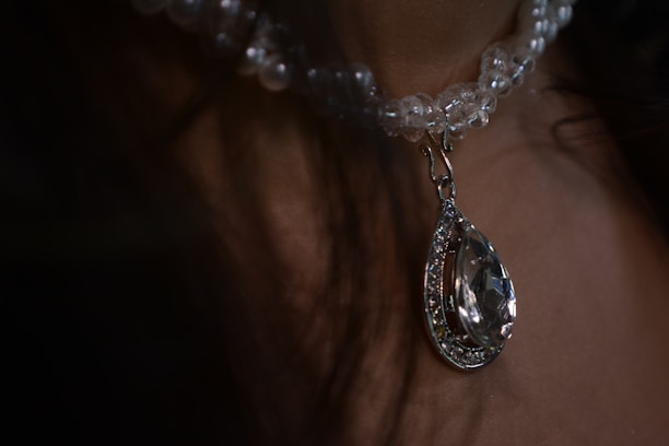 A close-up of a sparkling necklace showcasing its intricate details.