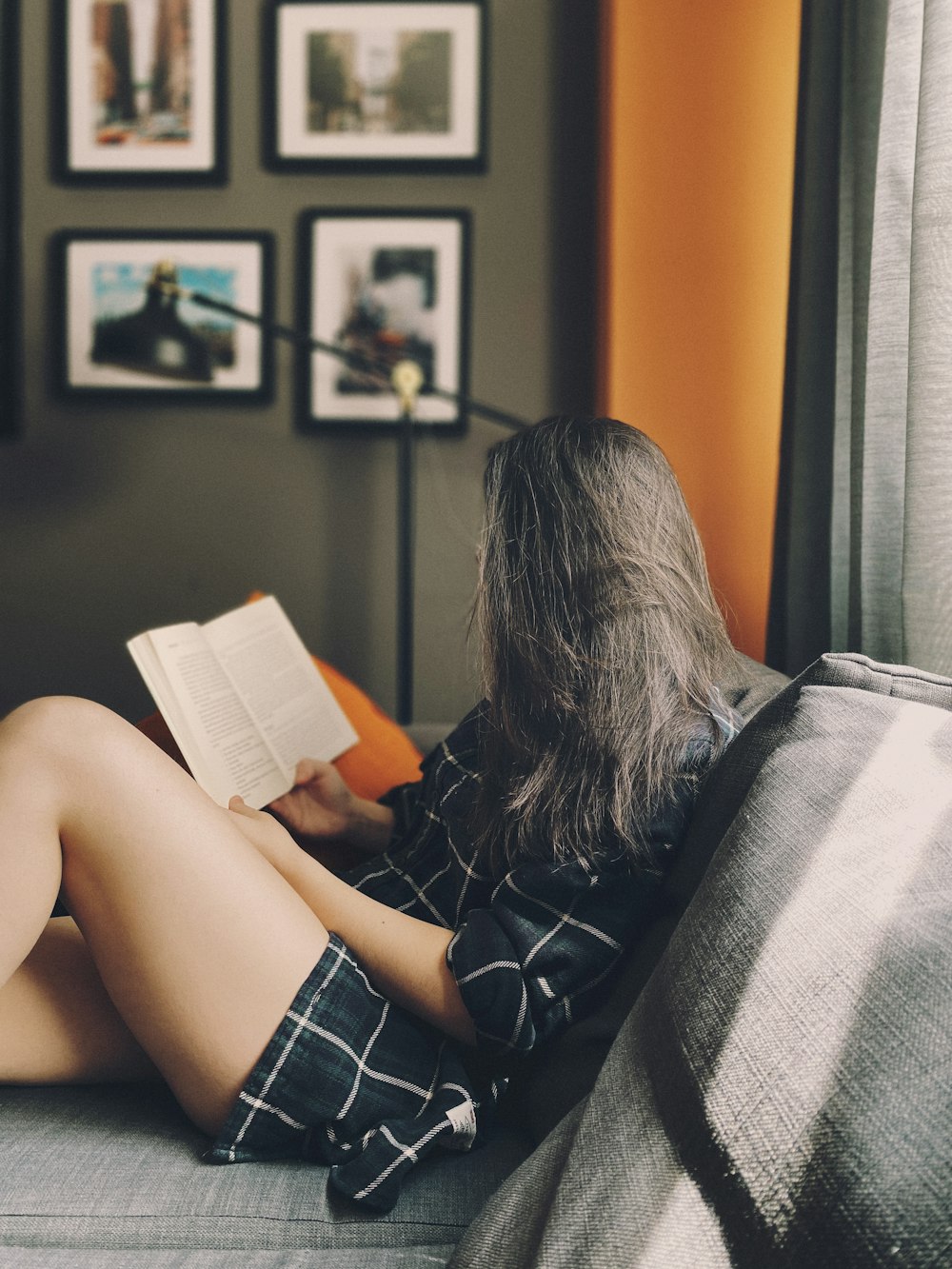 woman in black shirt reading book