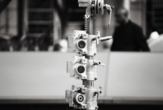 Bright, simple 1:1 photo of a metal structure assembler at work.