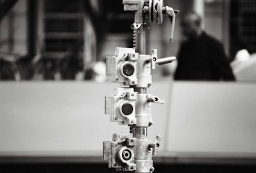 Bright, simple 1:1 photo of a metal structure assembler at work.