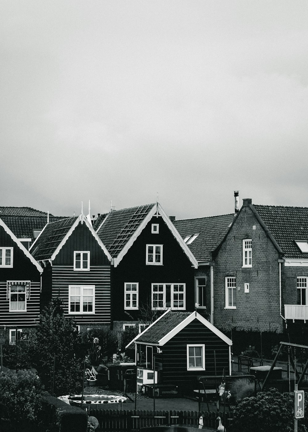 grayscale photo of houses during daytime