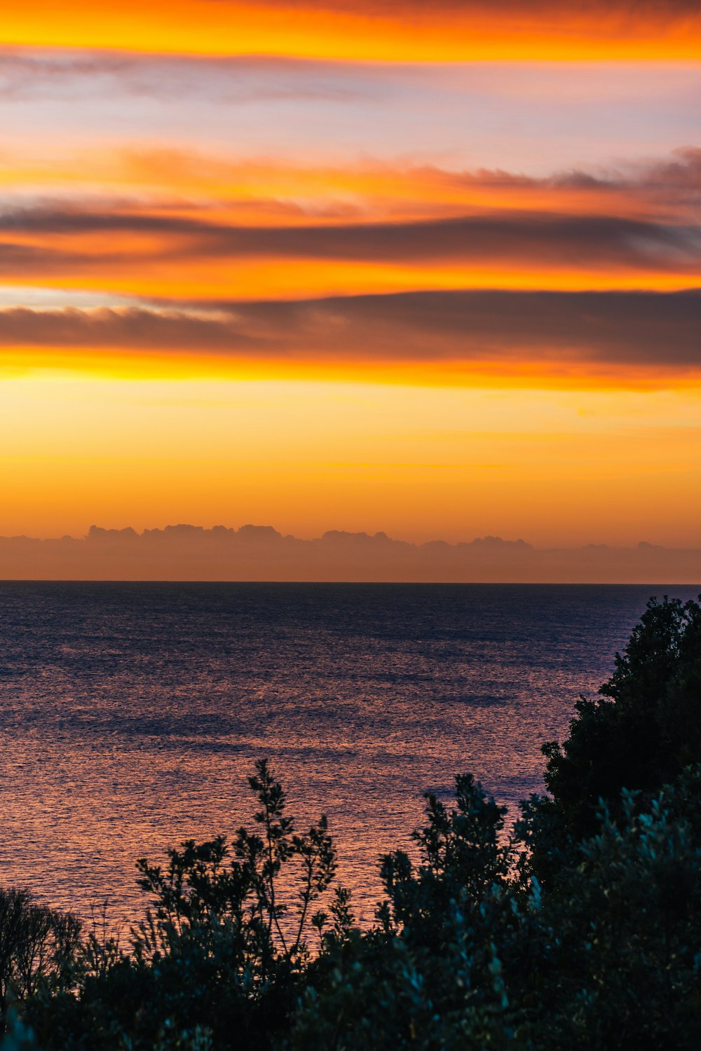 body of water during sunset