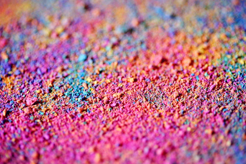 Vibrant copper powder spread evenly on a production table.