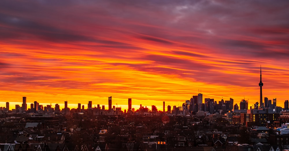 city skyline during orange sunset