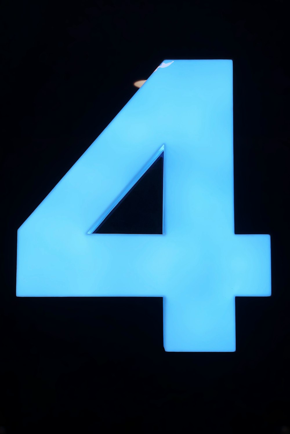 blue letter x on black background