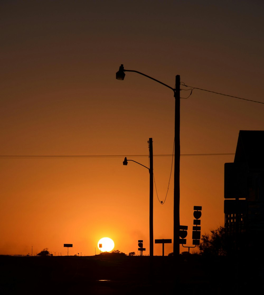 silhouette of street light during sunset