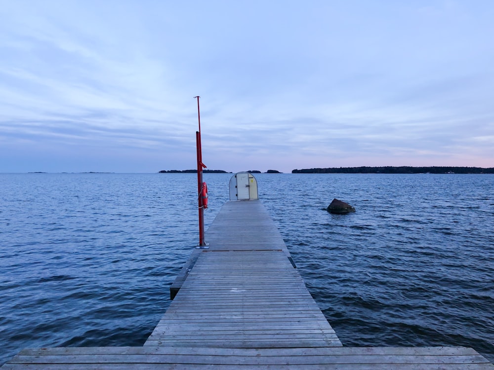 brown wooden dock on sea during daytime