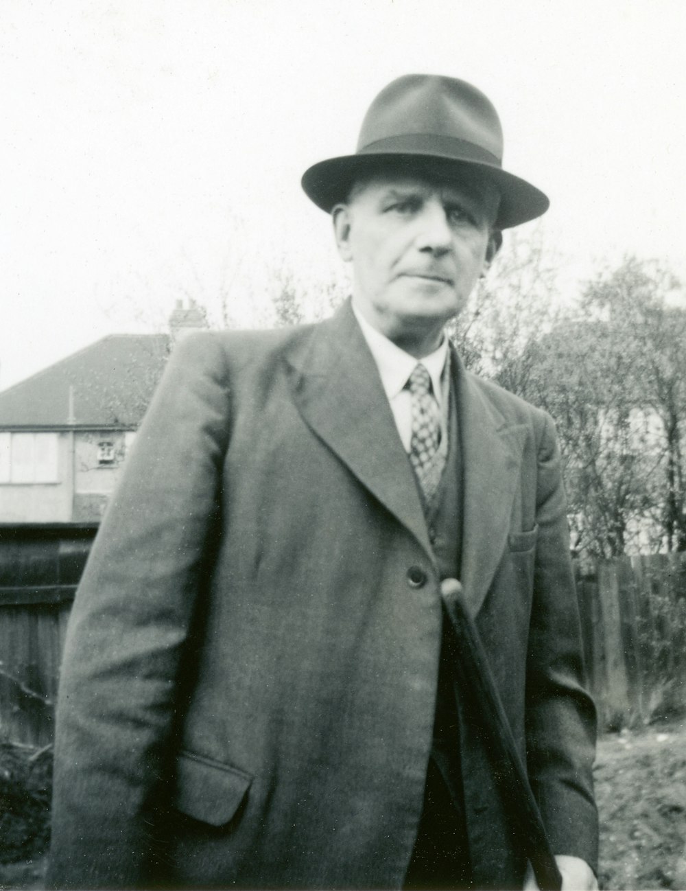 man in black suit jacket and black hat