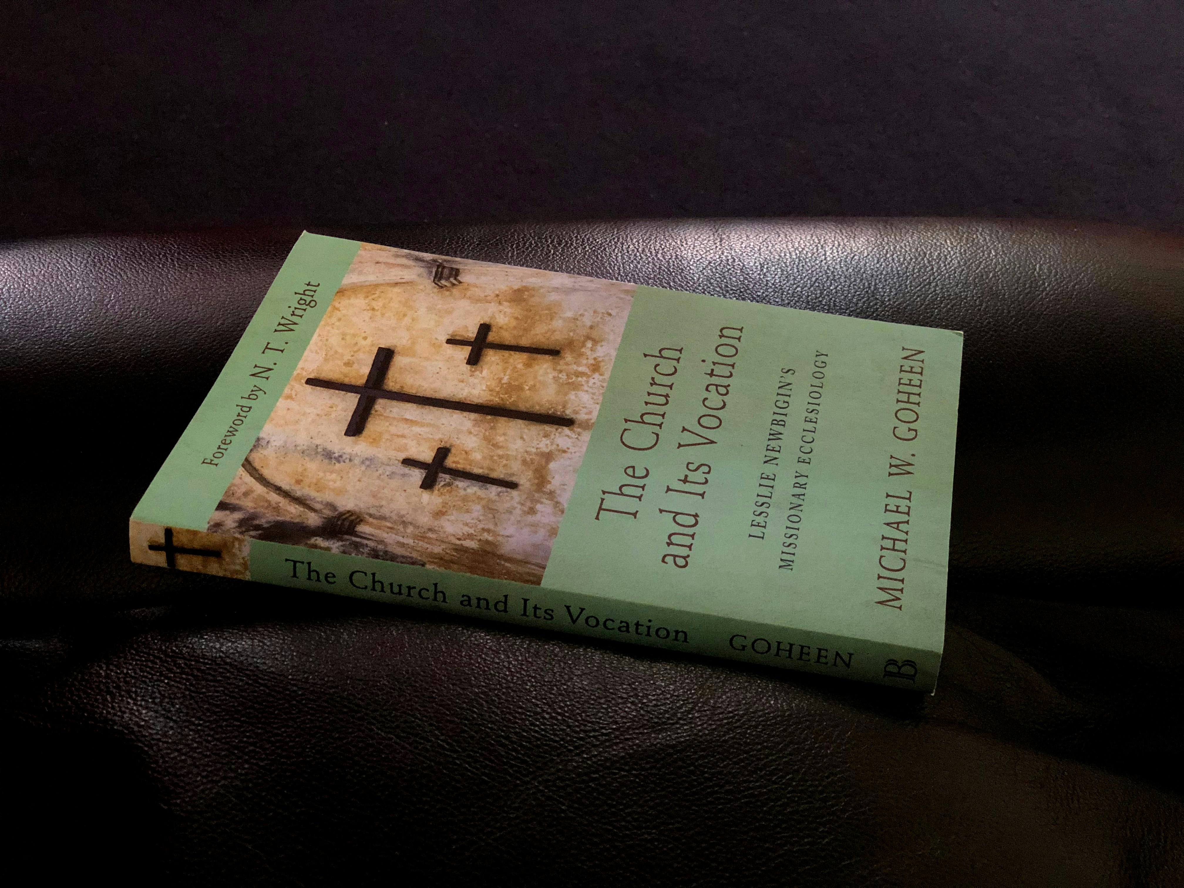 a book sitting on top of a leather couch