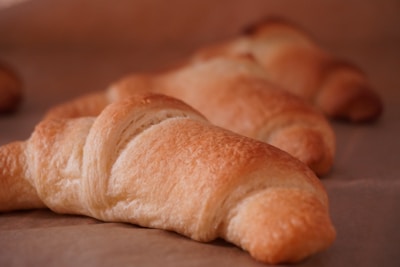 An open e-book displaying a detailed recipe for traditional French croissants.
