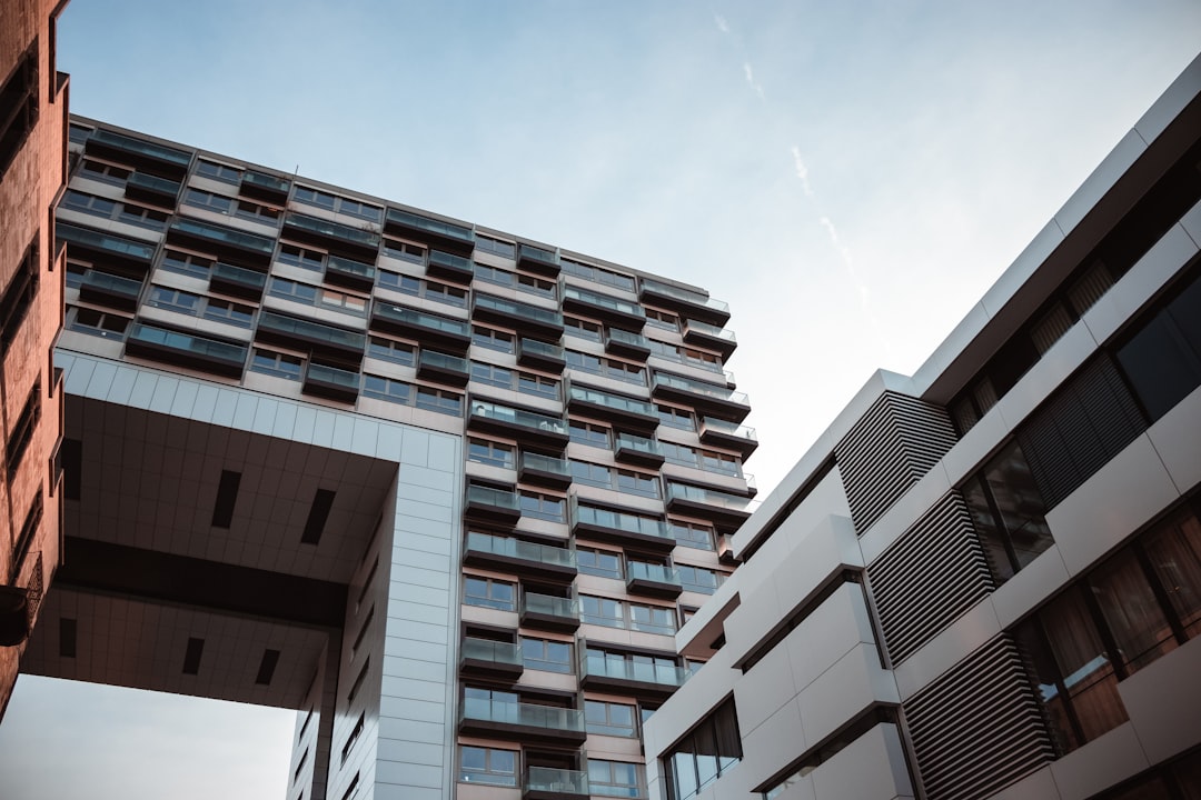 brown and white concrete building under blue sky during daytime