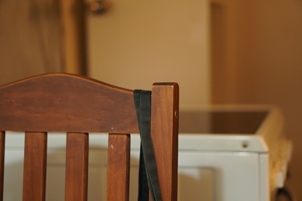 brown wooden chair beside white table